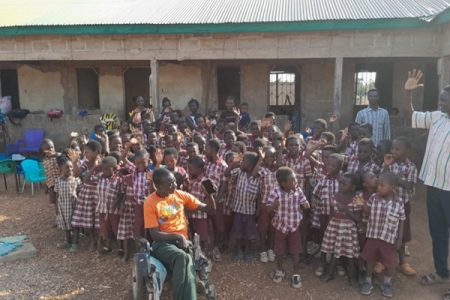 Adangabey brightens rural kids’ future from his wheelchair