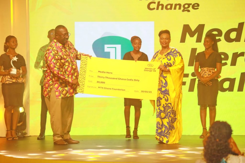 Jemima Kotei-Walsh, presents the Media Hero of the Year award to Samuel Atta Mensah, CEO of Citi FM